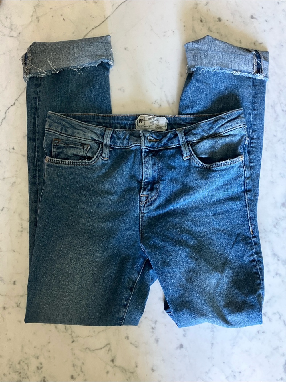 Free People Mid-Wash Skinny Jeans with Frayed Cuffs